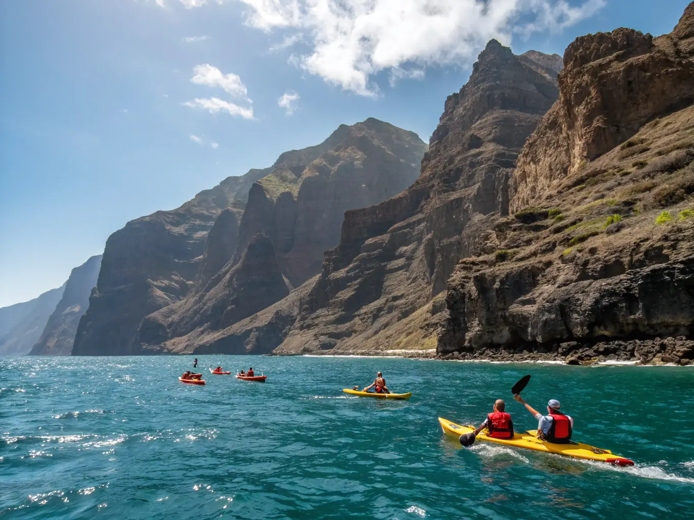 A diverse group of adults participating in a kayaking tour along a scenic coastline, with clear blue waters and rocky cliffs in the background. The image conveys a sense of adventure and camaraderie.